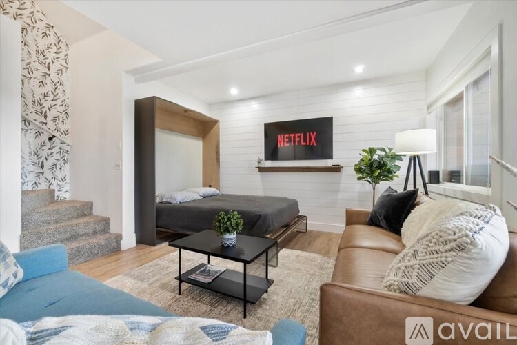 A living room with a Netflix sign on the wall.