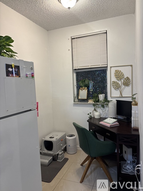 A room with a window and a wall-mounted air conditioner unit.