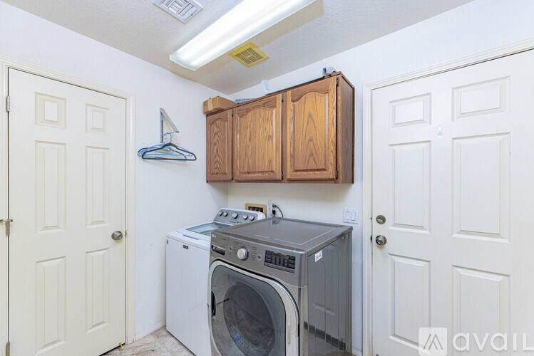 A washer and dryer in a small laundry room.