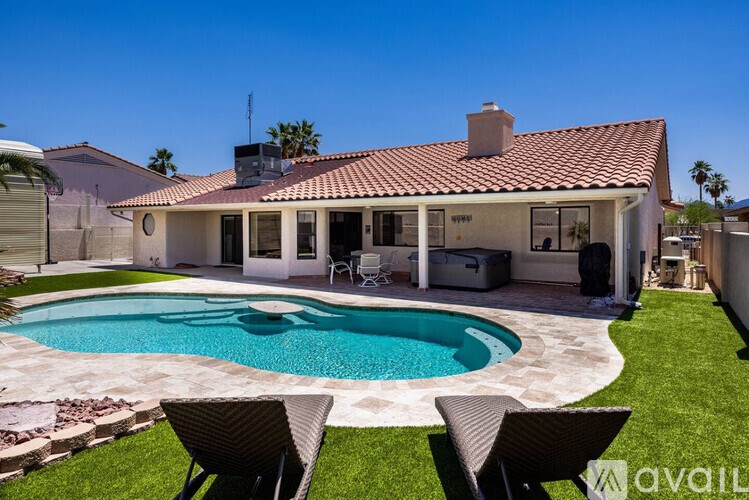 A house with a pool in the backyard.