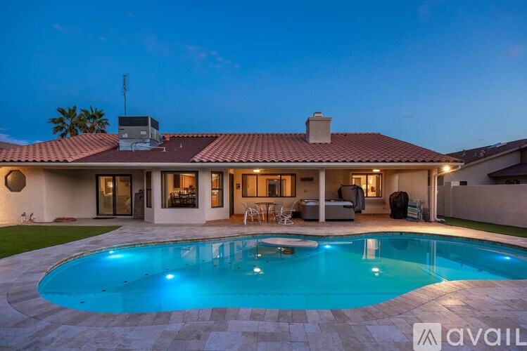 A house with a pool in the backyard.