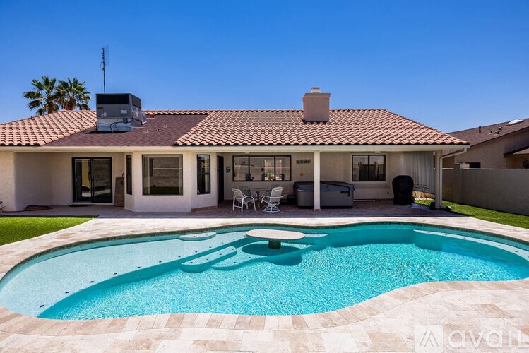 A house with a pool in the backyard.
