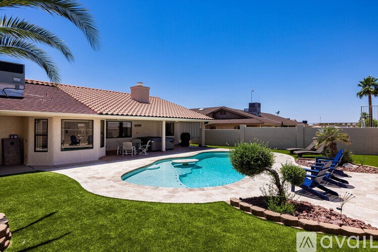 A house with a pool in the backyard.