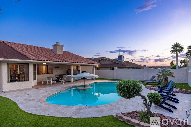 A house with a pool in the backyard.