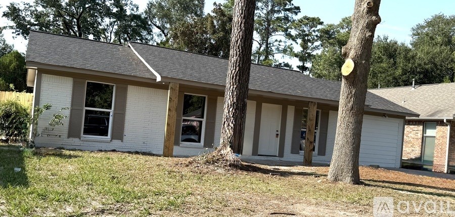 A small house with a tree in front of it.