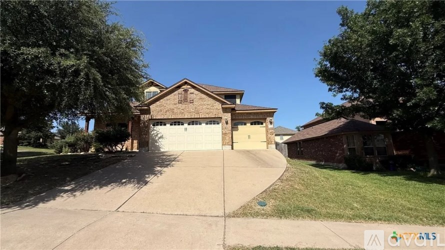 A house with a driveway in front of it.
