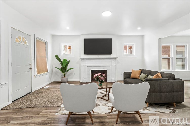 A room with a window overlooking a street.