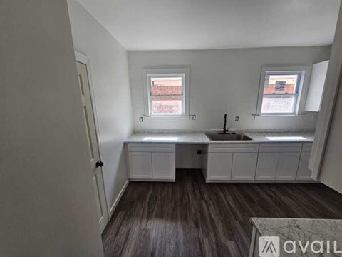 A kitchen with a sink and a window.