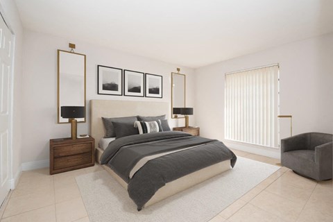 a bedroom with white walls and a large window and a bed