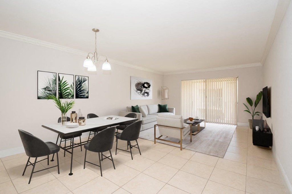 a living room and dining room with a table and chairs