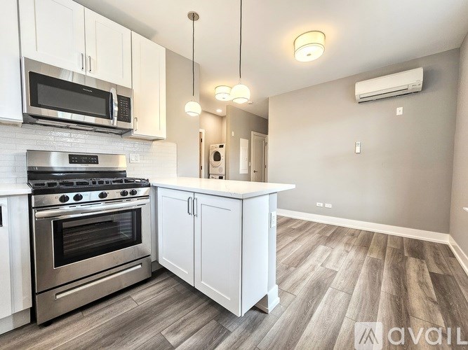 A kitchen with a stove top oven and microwave above it.