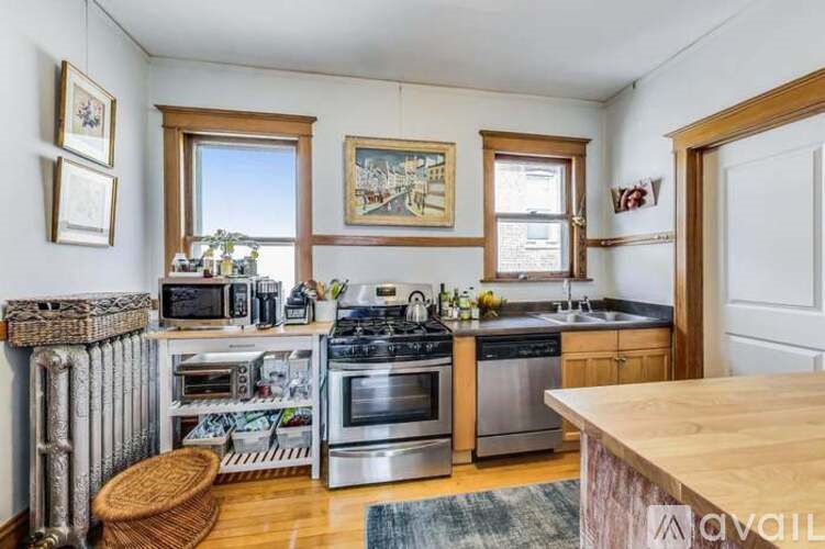 A kitchen with a stove top oven and a microwave.