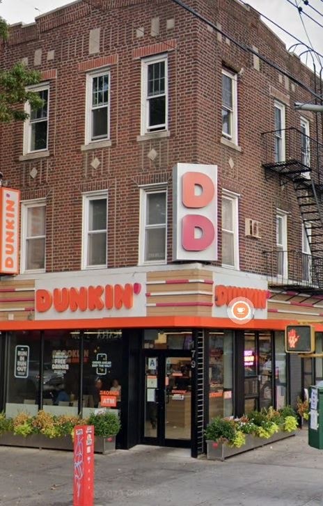 A Dunkin' Donuts storefront with a red and white sign.