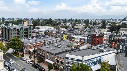 A city street with cars and buildings.