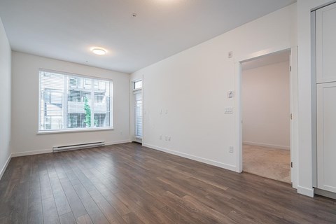 A room with a window and a door.