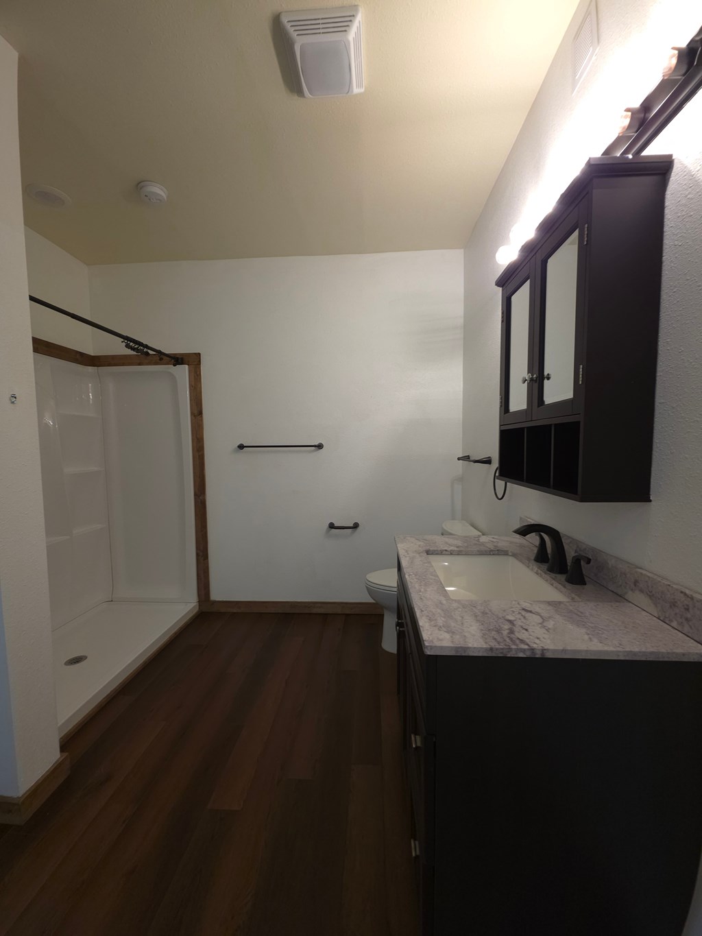 A bathroom with a sink and a mirror.