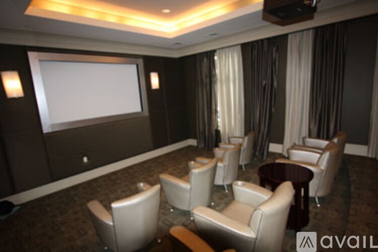 A large room with a chandelier and a couch.