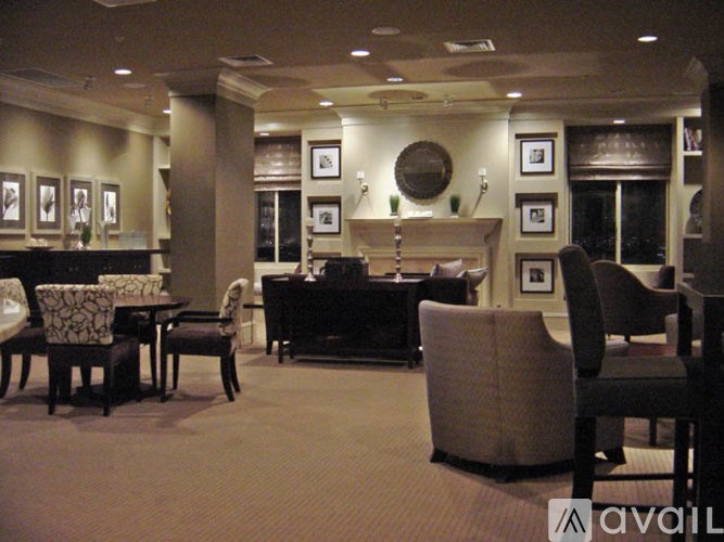 A living room with a piano and chairs.