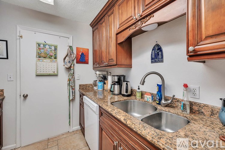 A room with a toilet and a shower curtain.