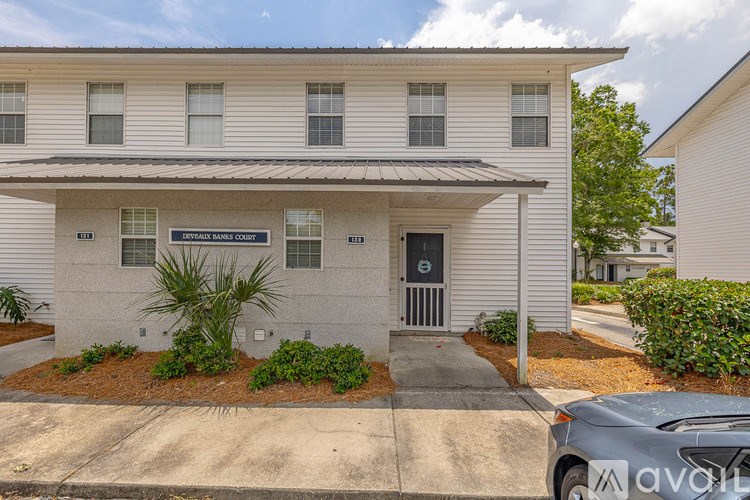 A room with tiled flooring and two doors.