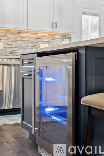 A modern stainless steel refrigerator with a water dispenser.