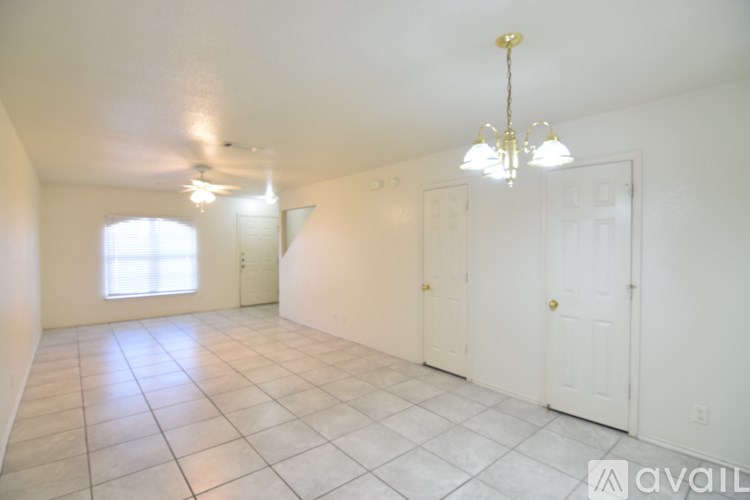 A room with white walls and a tiled floor.