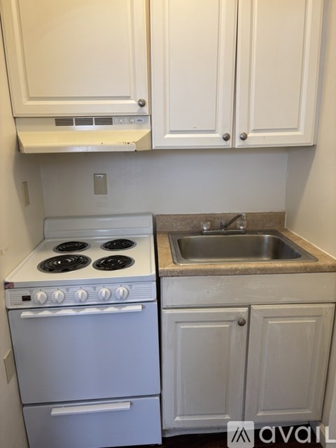 A white oven and sink in a kitchen.