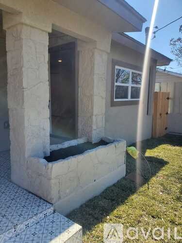 A small house with a window and a door.