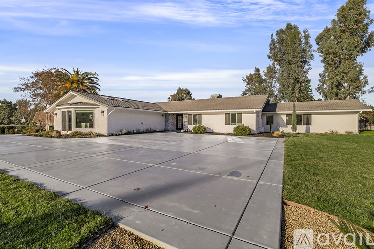 A house with a driveway in front of it.