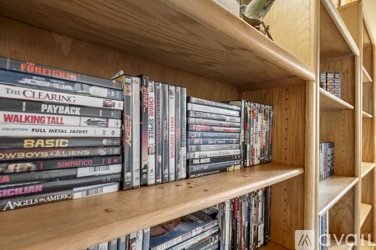 A shelf of DVDs including The Clearing, Walking Tall and Basic.