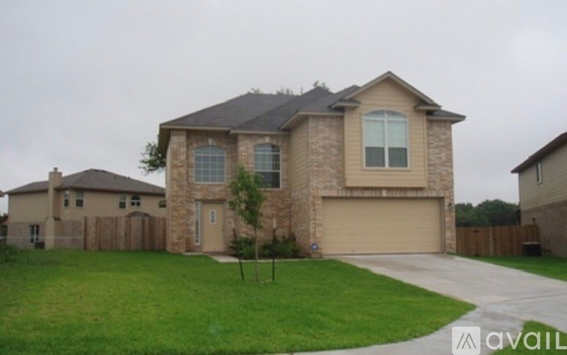 A house with a garage is available for sale.