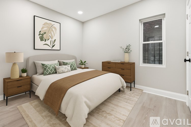 A room with a white door and a window with a view of a building outside.