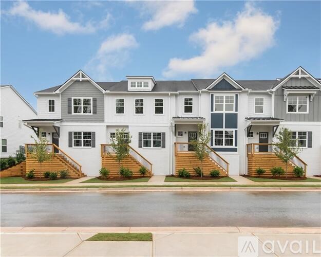 A row of houses with the first one being the most prominent.