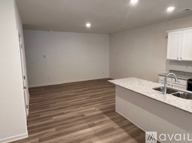 A kitchen with a sink and a countertop.