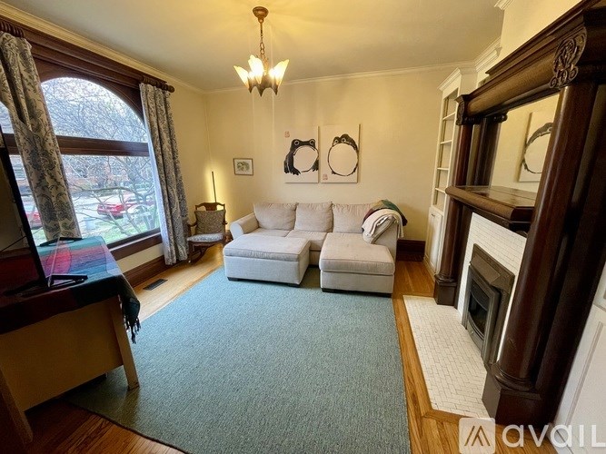 A living room with a fireplace and a couch.