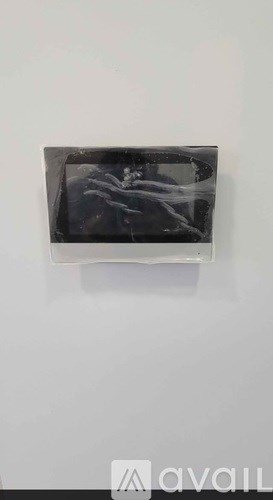 A black and white abstract painting on a wall.