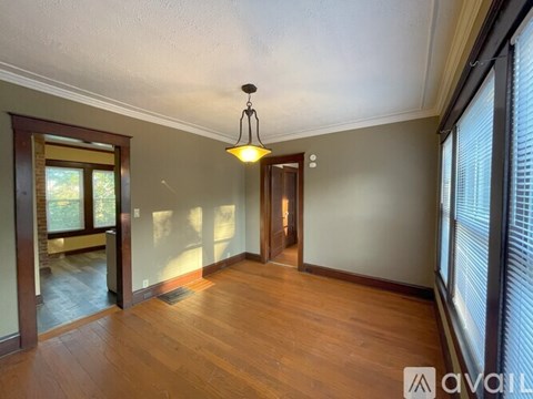 A kitchen with wooden cabinets and a white refrigerator.