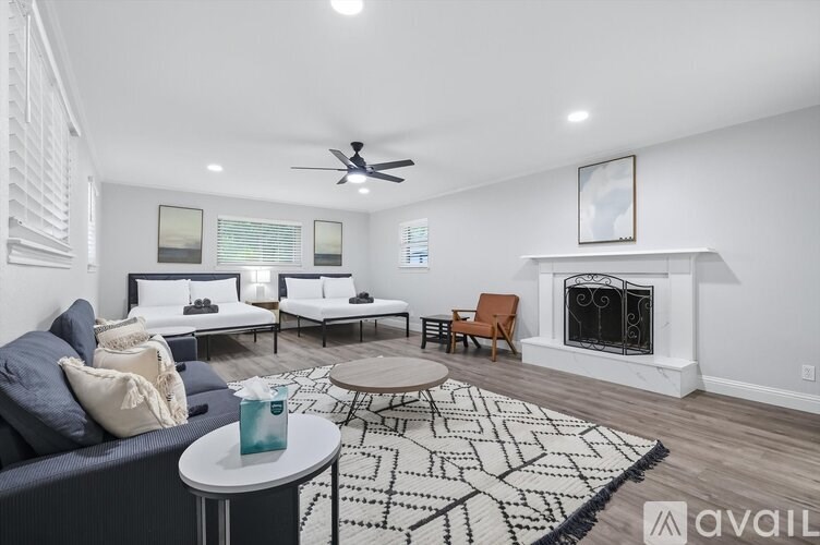 A living room with a fireplace and a couch.