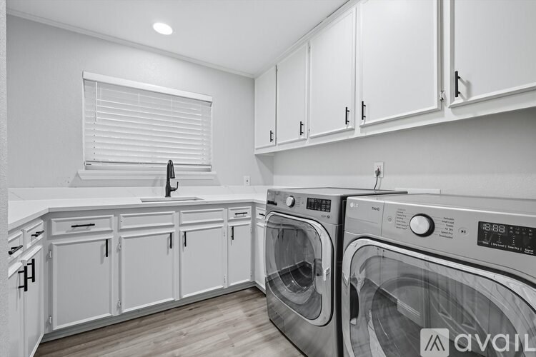 A laundry room with a washer and dryer.