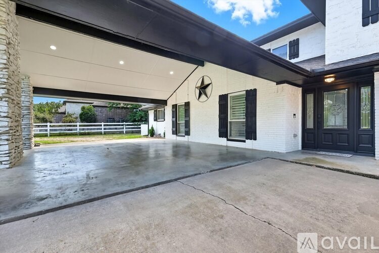 A house with a black door and a star on the wall.