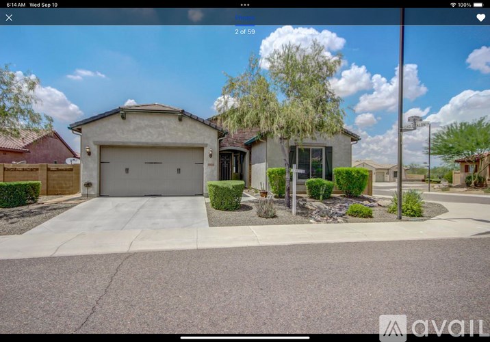 A house with a garage is available for sale.