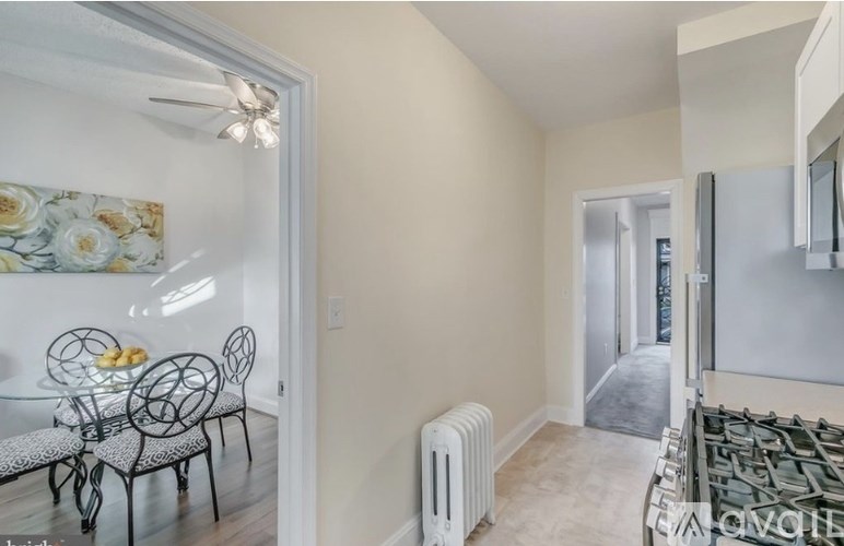 A dining room with a glass table and chairs.