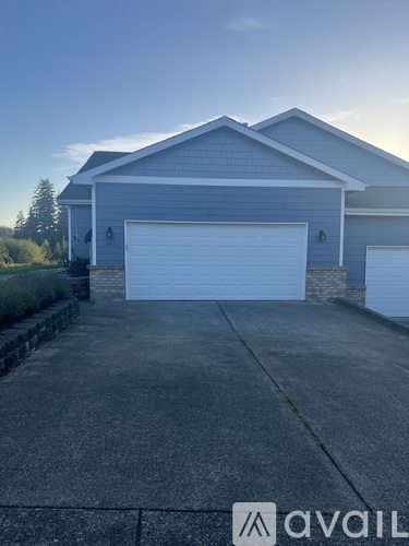 A two-car garage is attached to a house.