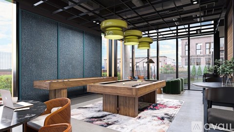 A modern living room with a pool table and a laptop on the coffee table.