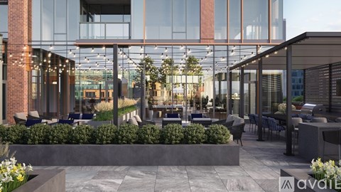 A modern outdoor seating area with tables and chairs is shown in front of a glass building.
