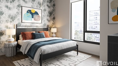 A bedroom with a large bed and a painting on the wall.