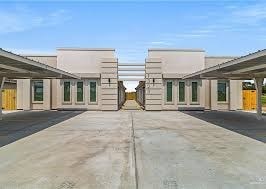 A building with a yellow door in the center.