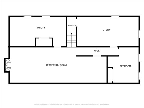 A floor plan of a room with a recreation room, two utility spaces, a hallway, and a bedroom.