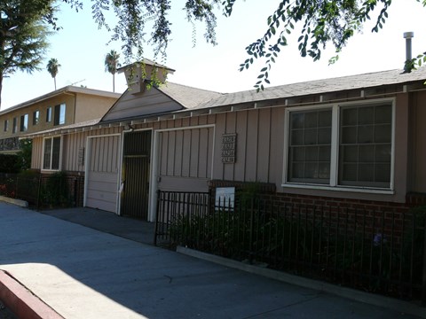 A building with a brown roof and a sign on it.