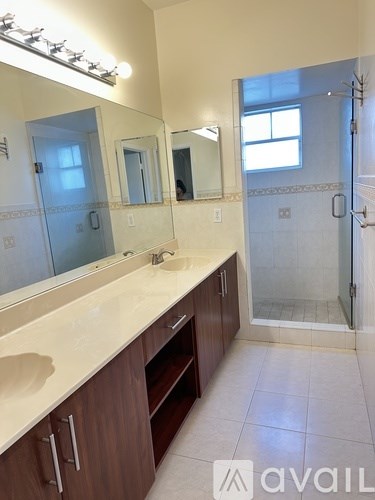 A patio with a bicycle and a hose.